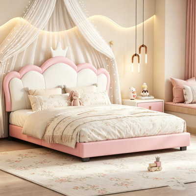 Lit double tapissier pleine grandeur avec tête de lit couronne, crème et rose, idéal pour les chambres élégantes et fantaisistes.