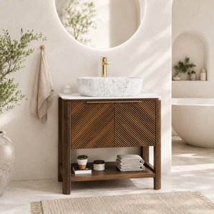 Meuble-lavabo autoportant moderne avec lavabo en marbre, plateau en pierre frittée et portes d'armoire cannelées