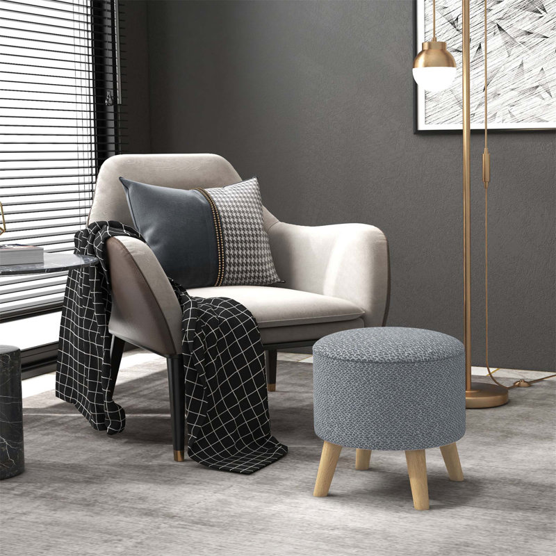 Repose-pieds polyvalent avec rangement dissimulé et confort coussiné