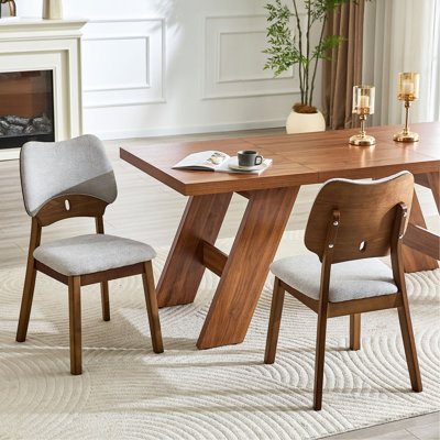 2 solid wood dining chairs, with  soft fabric packaging on the backrest and seat cushion, hollowed out design backrest, for home dining chairs.