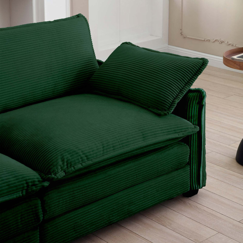 Canapé simple à assise profonde avec repose-pieds et coussin, salon