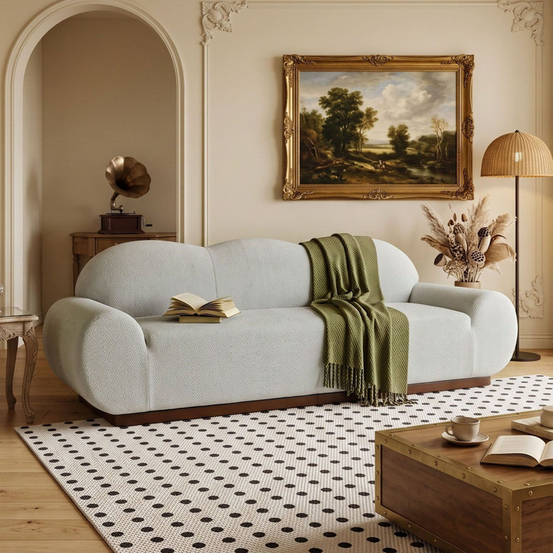 Canapé 3 places Cloud incurvé de 224 cm (88 po), recouvert de tissu capitonné, avec accoudoirs arrondis, coussins en mousse haute densité et base en fer.