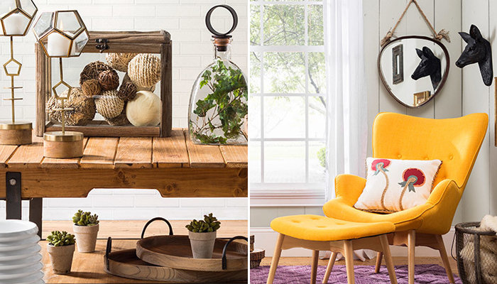 a wooden table with geometric class candle holders, terrarium, and collection of natural curios