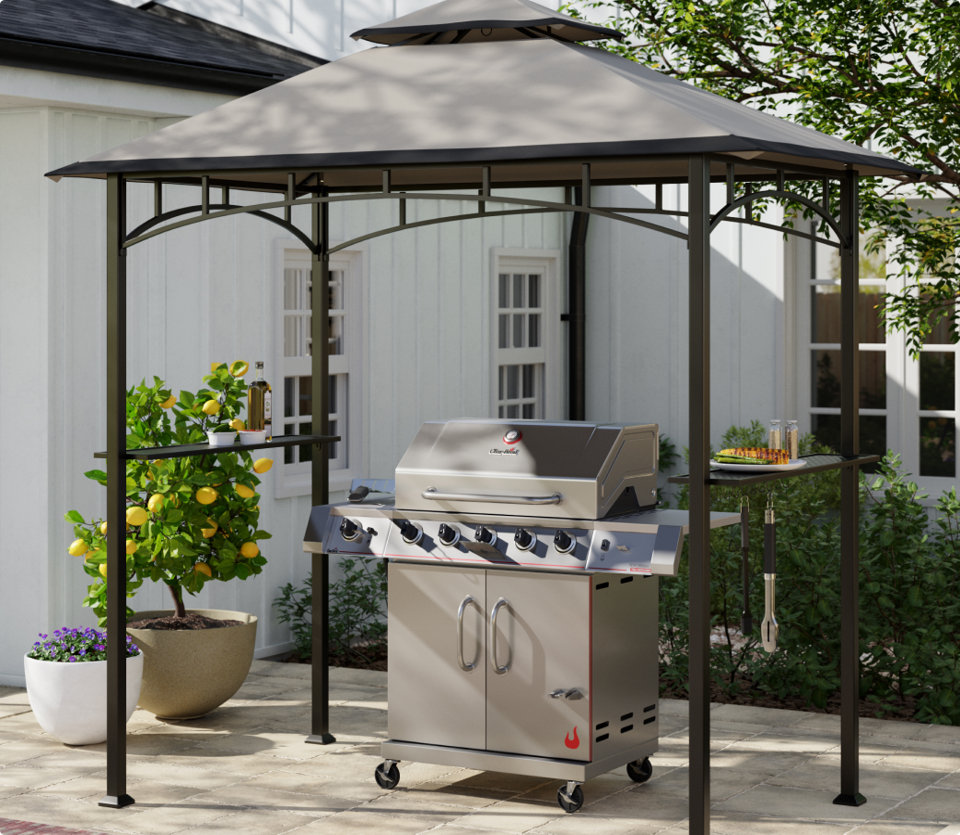 Outdoor barbecue grill with a canopy.