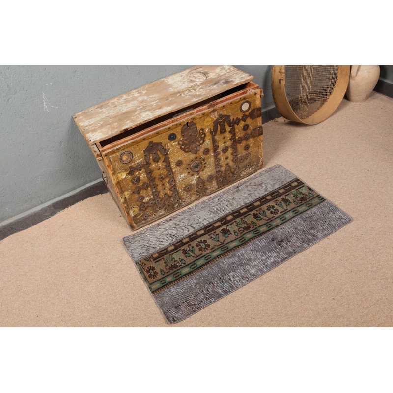 Élégant tapis bohémien aux tons terreux dans un motif unique de tapis de porte turc rétro
