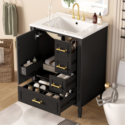 Meuble-lavabo moderne de 24 po avec lavabo en céramique, porte à fermeture douce, 3 tiroirs, poignées dorées et support de porte pour un rangement peu encombrant