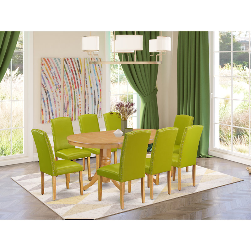 9 Piece Dining Set Includes an Oval Dining Room Table with Butterfly Leaf and 8 Autumn Green Faux Leather Upholstered Chairs, Oak
