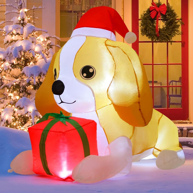 Chien gonflable de Noël illuminé 5 pi portant un chapeau de père Noël - Allongé avec les pattes avant sur la boîte-cadeau