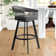 Robinett Swivel Counter or Bar Height Bar Stool with Arms and Footrest in Faux Leather and Metal