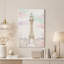 Tableau sur toile représentant une tour ornée de fleurs roses dans des nuages ​​pastel-2037585460