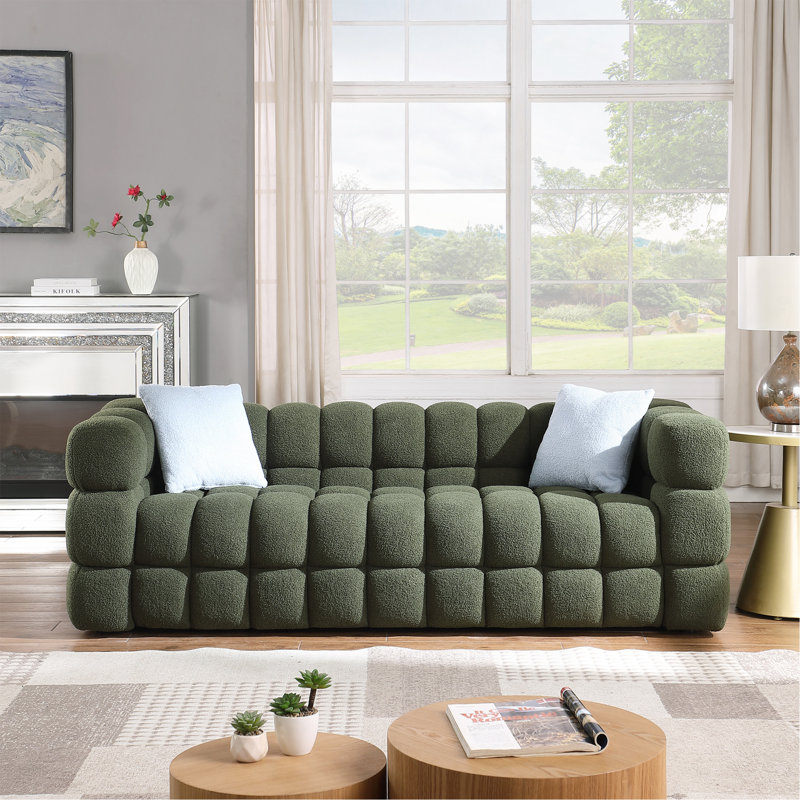 Canapé confortable et élégant avec coussins moelleux et revêtement de qualité supérieure, parfait pour se détendre et recevoir.