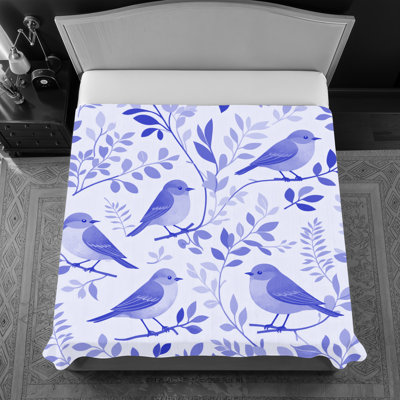 Couvre-lit fin matelassé à motif d'oiseaux sur des branches