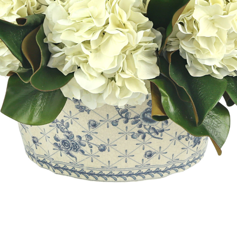 Hydrangeas and Magnolia Leaves Arranged in Decorative Vase