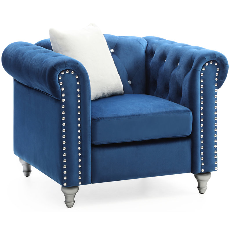 Fauteuil confortable en velours à accoudoirs arrondis pour une lecture décontractée en bleu marine