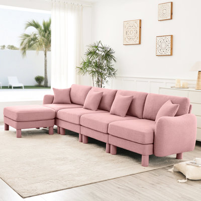 Canapé convertible en L rose à 4 places en tissu bouclé avec pieds en forme de coquillage, amovibles et cylindriques. Construisez des sièges confortables pour n'importe quelle pièce. Revêtement doux pour les jambes