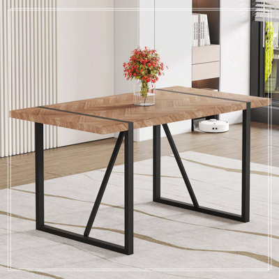 Table de salle à manger rectangulaire avec un dessus spécialement texturé et des pieds en métal noir