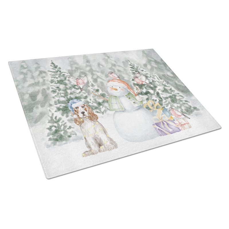 Épagneul cocker rouge et blanc avec cadeaux de Noël