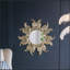 Magnifique miroir décoratif en métal Sunburst, une magnifique œuvre d'art murale pour n'importe quelle pièce.