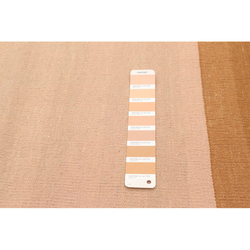 Tapis géométrique beige en laine à tissage plat