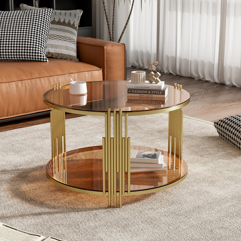 Table basse moderne en verre brun, métal asymétrique, base cylindrique en métal, finition dorée et tablette inférieure