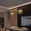 Luminaire suspendu moderne en forme de globe doré à 1 lumière avec lampe en acrylique de forme irrégulière pour la salle à manger et le vestibule
