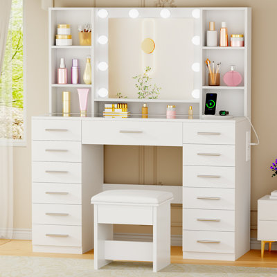 Adriel 43.3" Makeup Vanity With Mirror & Lights, Power Outlet, 13 Drawers & 7 Shelves, Glass Top and Cushioned Stool