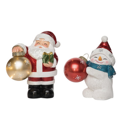 Transpac Resin 10 in. Multicolored Christmas Light Up Snowman with Santa Hat Holding Ornament