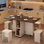 5 PCS Farmhouse Folding Dining Table Set for 4, 60'' Drop Leaf Table Set with 4 Leather Chairs, 2-Layer Storage Shelf, 6 Wheels, Barn Door Design, Space Saving Foldable Kitchen Table for Small Spaces