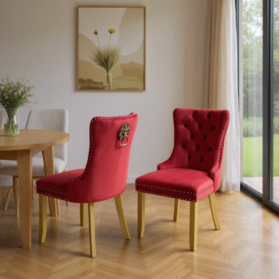 Ensemble de deux chaises d'appoint en velours capitonné rouge et or et bois massif