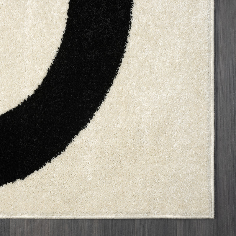 6' x 9' Black and Beige Abstract Rectangular Rug