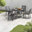 Table de patio robuste, surface en lattes de faux bois, salle à manger d'extérieur moderne