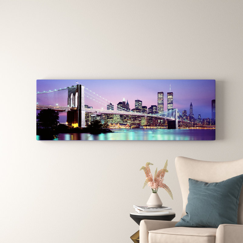 An Illuminated Brooklyn Bridge With Lower Manhattan's Financial District Skyline In The Background, New York City, New York - No Frame Panoramic Print on Canvas