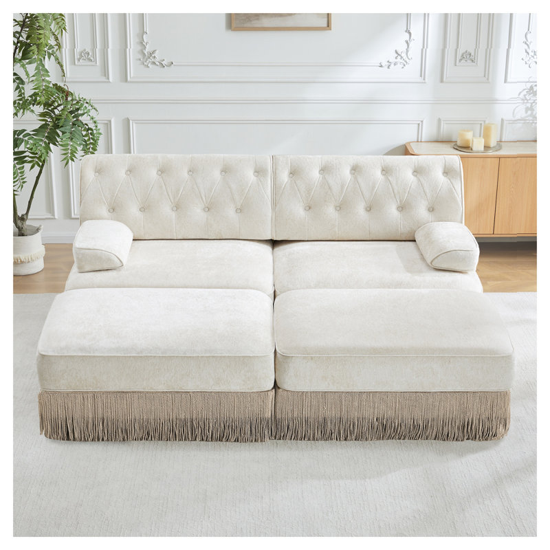 Canapé modulaire en velours beige avec 2 repose-pieds, dossier capitonné et jupe à pampilles
