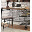 Bureau d'inspiration industrielle avec un plateau en bois noir antique et des roulettes décoratives