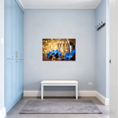 Plantes et fleurs, verres à champagne, orchidées bleues, lumières dorées, bougie, seau à glace