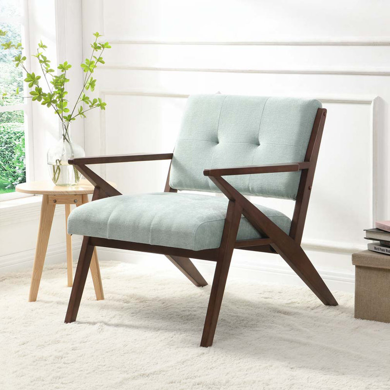 Fauteuil en tissu vert clair avec pieds en bois