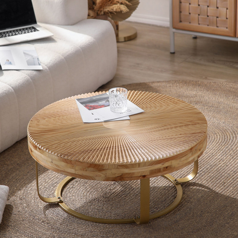 Table basse moderne et ronde à motif sculpté en bois avec pieds en métal