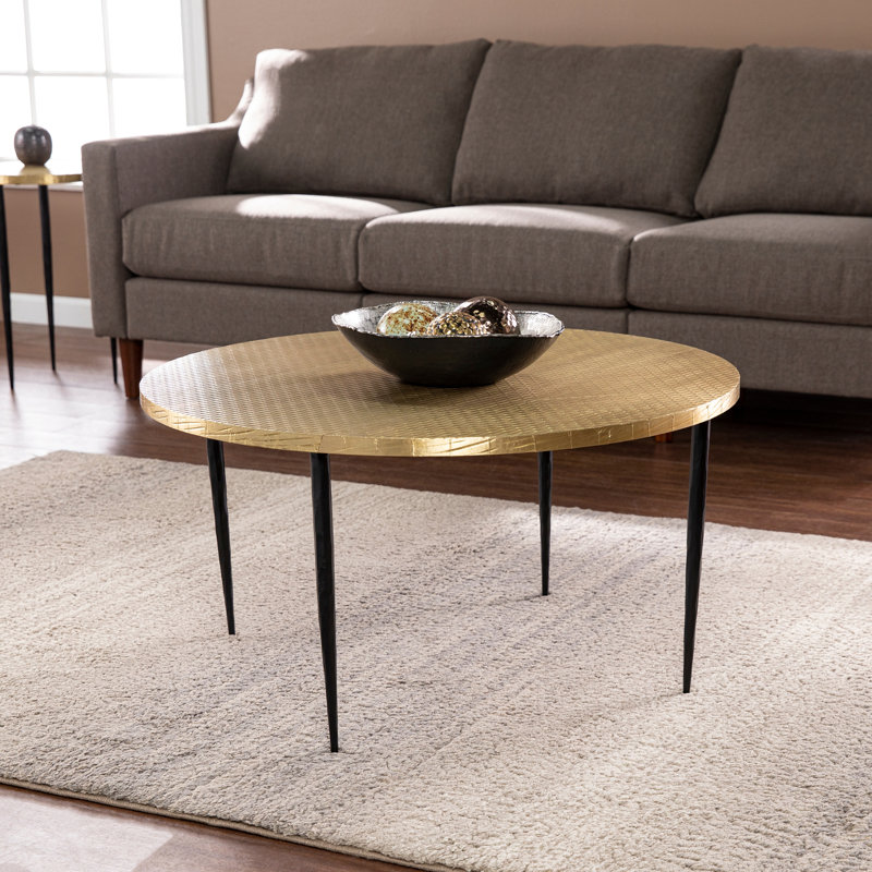 Table basse ronde avec plateau en relief