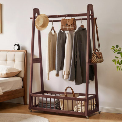 Portant à vêtements en bois massif avec roulettes verrouillables, double tringle, crochets latéraux et panier de rangement inférieur, portant autoportant, organisateur de vêtements à roulettes pour chambre ou entrée.