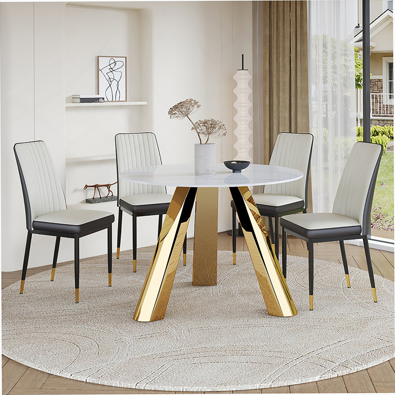 pouces de table de salle à manger ronde en pierre brûlée avec base en acier inoxydable et ensemble de chaises en polyuréthane 4 pièces