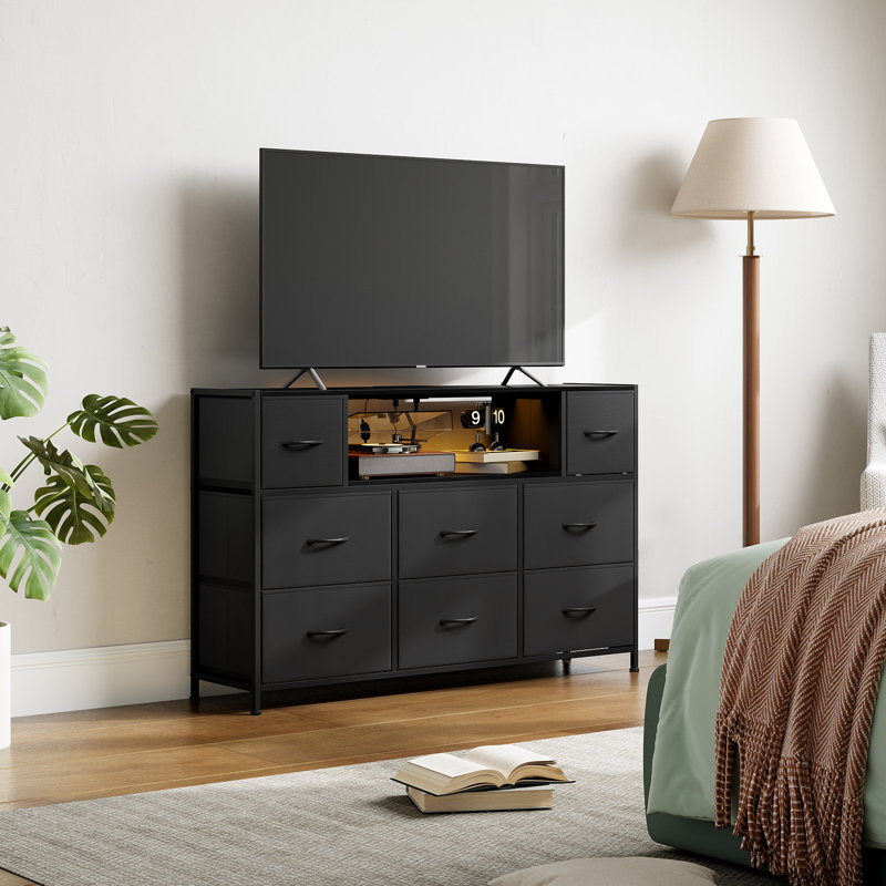 Meuble télé noir Eunos pour téléviseur 65 po avec 8 tiroirs, DEL et prises de courant pour chambre à coucher, salon, black