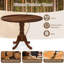 Table de salle à manger en bois avec plateau rond et pieds en tréteaux-1118772877