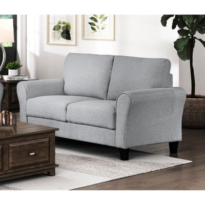 Salon moderne avec revêtement en tissu texturé gris foncé et ressorts ensachés