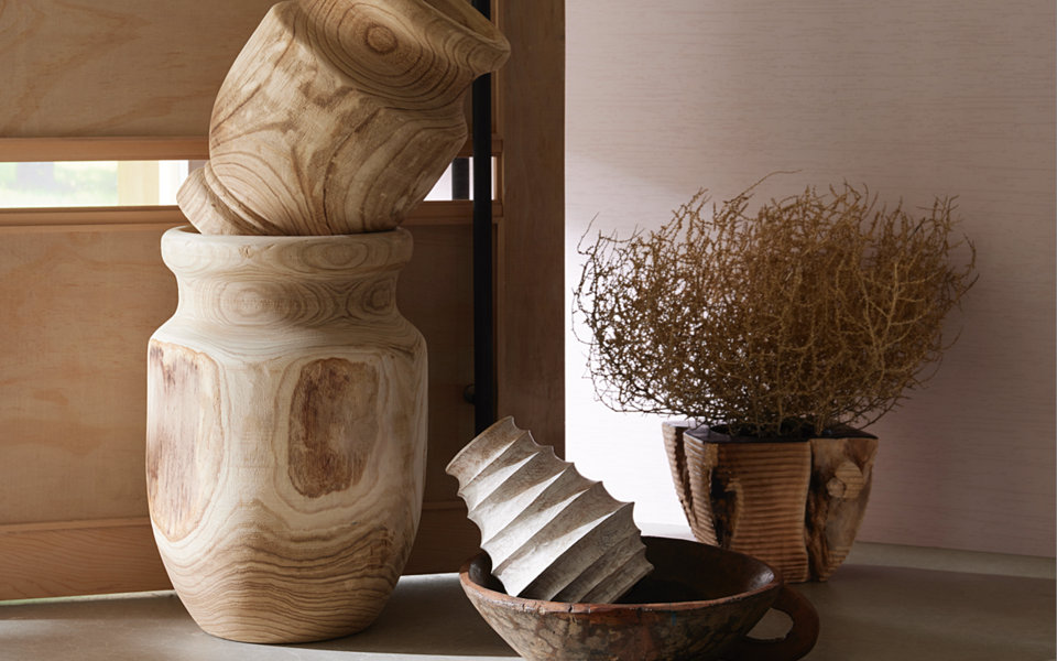 Still life of decorative vases and plants.