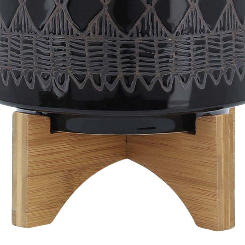Pot à fleurs en céramique sur support en bois