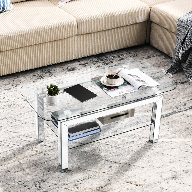 Élégante table basse rectangulaire en verre trempé avec tablette et pieds en miroir