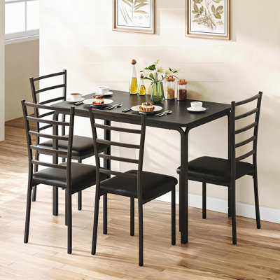 Ensemble de table de salle à manger moderne 5 pièces pour 4 personnes - plateau de table en panneau de fibres à densité moyenne - 4 chaises rembourrées en polyuréthane - Structure en métal robuste - Idéal pour la cuisine, la salle à manger et l’appartement - Couleur: noir, plateau de table en panneau de fibres à densité moyenne