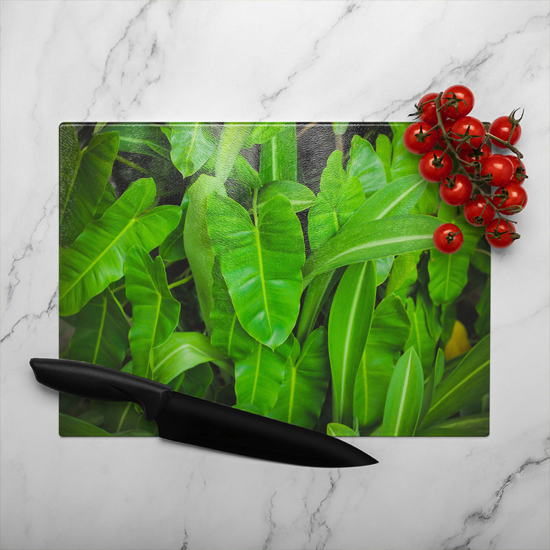 Abstract background of leaves Designer Glass Chopping Board, 40cm L x 28cm W