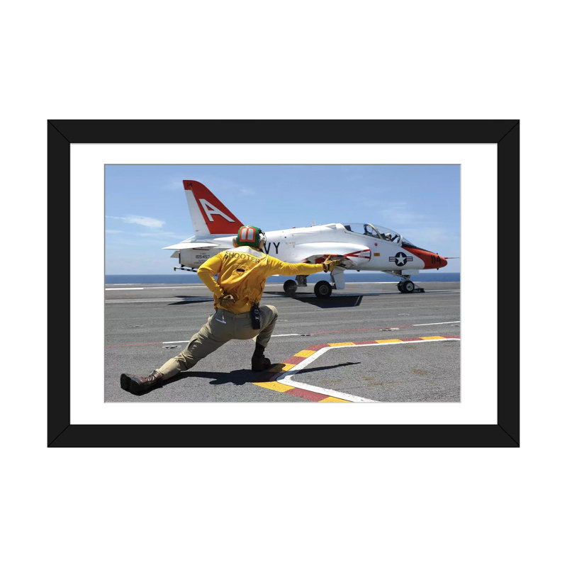 " Shooter Signals To A T-45C Goshawk As It Launches From USS George HW Bush " by Stocktrek Images, 16" H x 24" W x 1" D