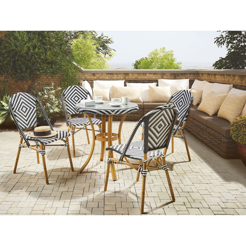 Gesine 4 - Person Wicker Patio Dining Set with Round Table , Cushions Included